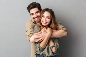 Young unmarried couple happy about their estate planning